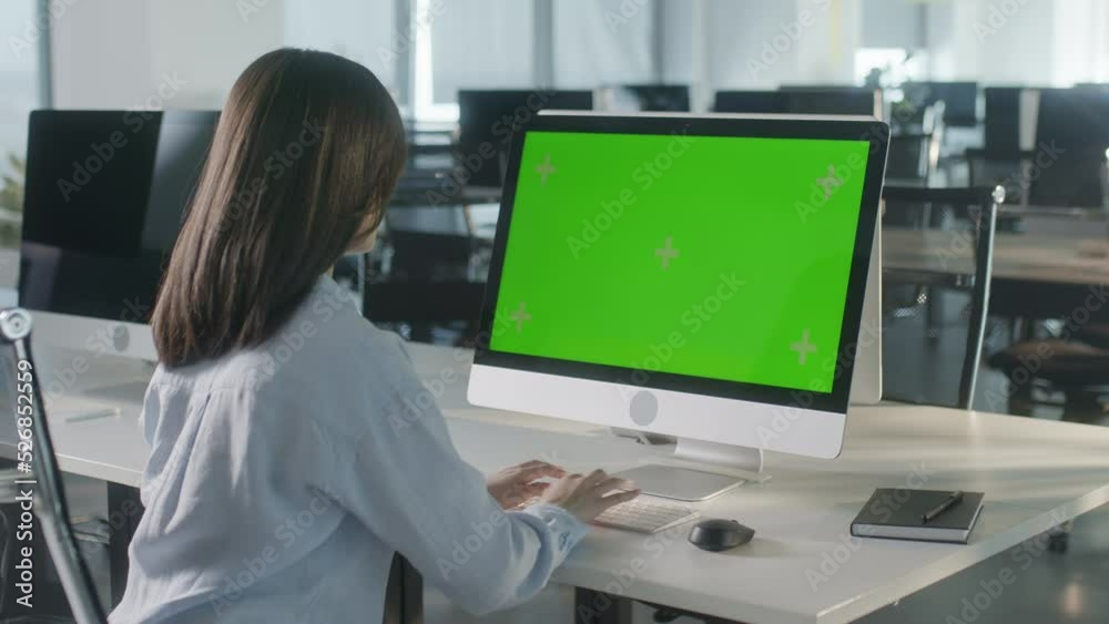 Business Woman Hands Working Internet on Computer On Desk. Girl Typing Keyboard on PC with Green Screen Notebook. Close Up Female Freelancer Searches For Information on The Internet Business Woman Hands Working Internet on Computer On Desk. Girl Typing Keyboard on PC with Green Screen Notebook. Close Up Female Freelancer Searches For Information on The Internet
