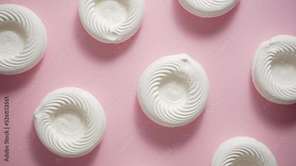 Empty meringue nests placed on a pink background