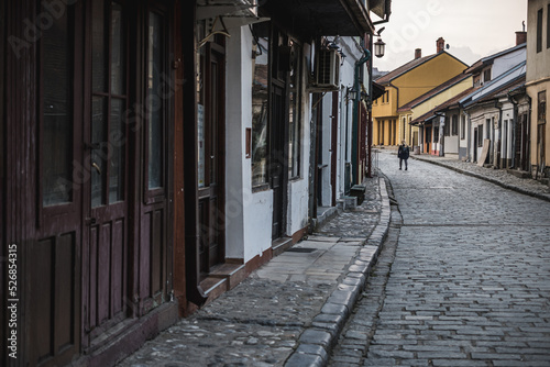 Old, historic, narrow street covered in cobblestone in Valjevo, Serbia photo