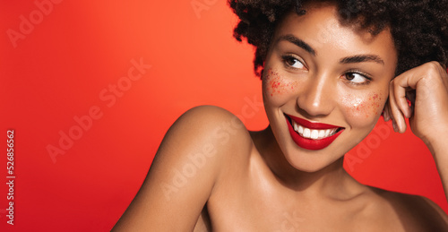 Εκτύπωση καμβά Close up of beautiful african american woman with red lipstick, happy smile, bar