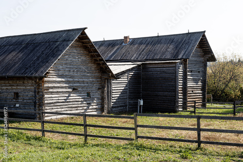 Old wooden architecture. Old traditional Russian peasant houses.