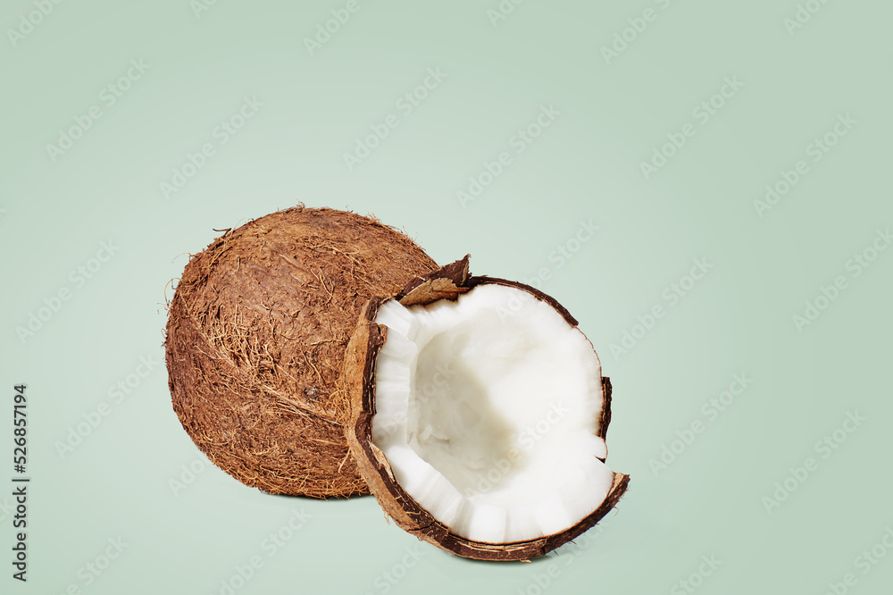 Coconut on green background. Food concept. Coconut on green background. Food concept.