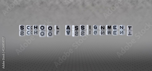 school assignment word or concept represented by black and white letter cubes on a grey horizon background stretching to infinity