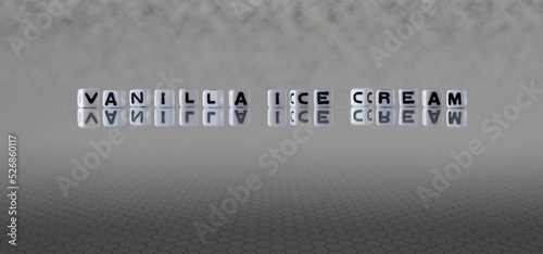 vanilla ice cream word or concept represented by black and white letter cubes on a grey horizon background stretching to infinity