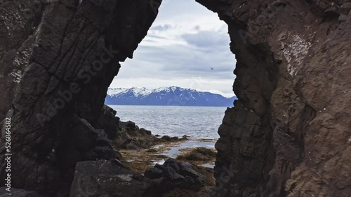 Magnificent Seascape of North Iceland Shore. Arch Rock Near Town of Husavik photo