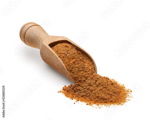 Wooden scoop full of palm sugar isolated on white background