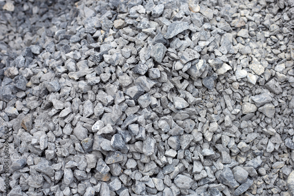 Gray rubble construction rock. Stones background Gray rubble construction rock. Stones background