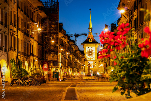Night scene along Kramgasse in the old town of Bern (Berne, Berna), Switzerland. Zytglogge  Clock Tower, rebuilt in 1405, with moving mechanical figures and an astronomical clock. photo