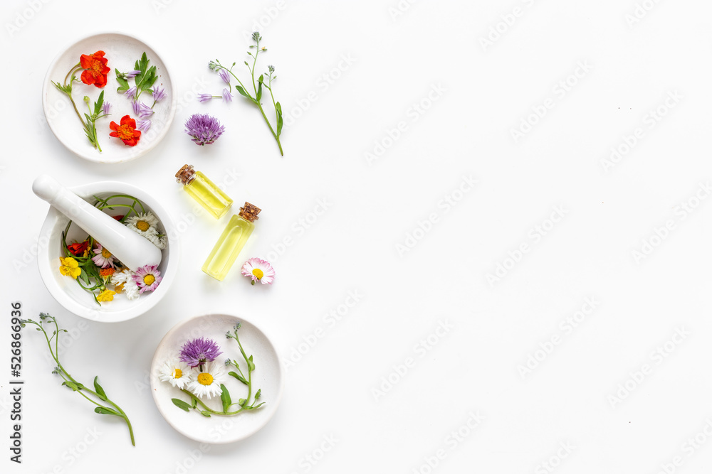 Medicinal herbs with mortar and essential oil bottle. Herbal apothecary Medicinal herbs with mortar and essential oil bottle. Herbal apothecary