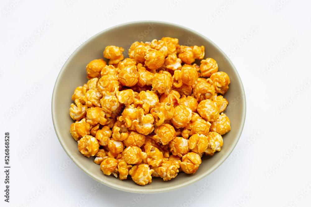 Honey caramel popcorn on white background. Honey caramel popcorn on white background.