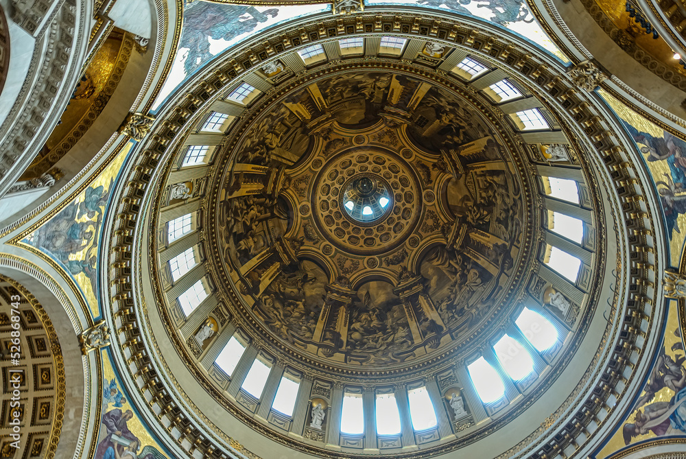 London, England, UK - July 6, 2022: St. Paul's Cathedral. Looking up, inside church, into dome. Light through windows, white statues and paintings galore.