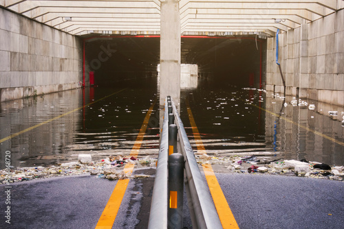 Traffic tunnel was so flooded that it could not be used with residual waste causing drains to clog Image that have been processed and color manipulated already Blur foreground to emphasize focus point