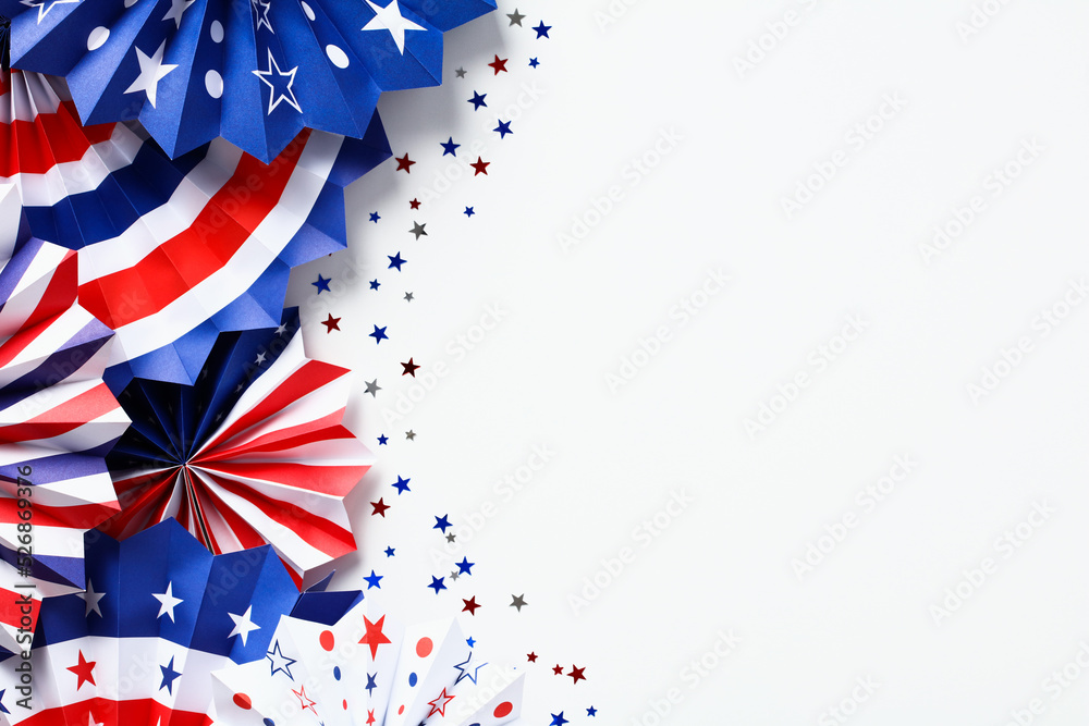 Obraz premium Happy Labor Day, Independence Day, Veterans day banner design. Flat lay red, white, and blue USA paper fans isolated on white background.