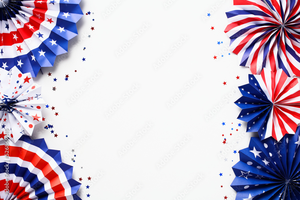 Obraz premium Frame made of USA flag color paper fans on white background. Happy Labor Day, Presidents Day, Fourth of July, Columbus day concept.