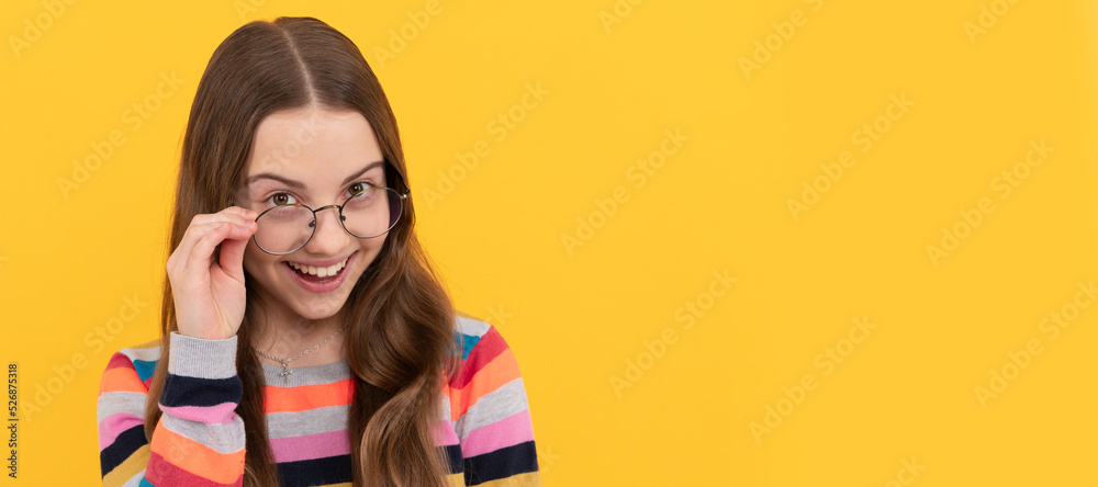 Fototapeta premium vision correction. eye health. optical eyecare. back to school. knowledge and education. Child face, horizontal poster, teenager girl isolated portrait, banner with copy space.