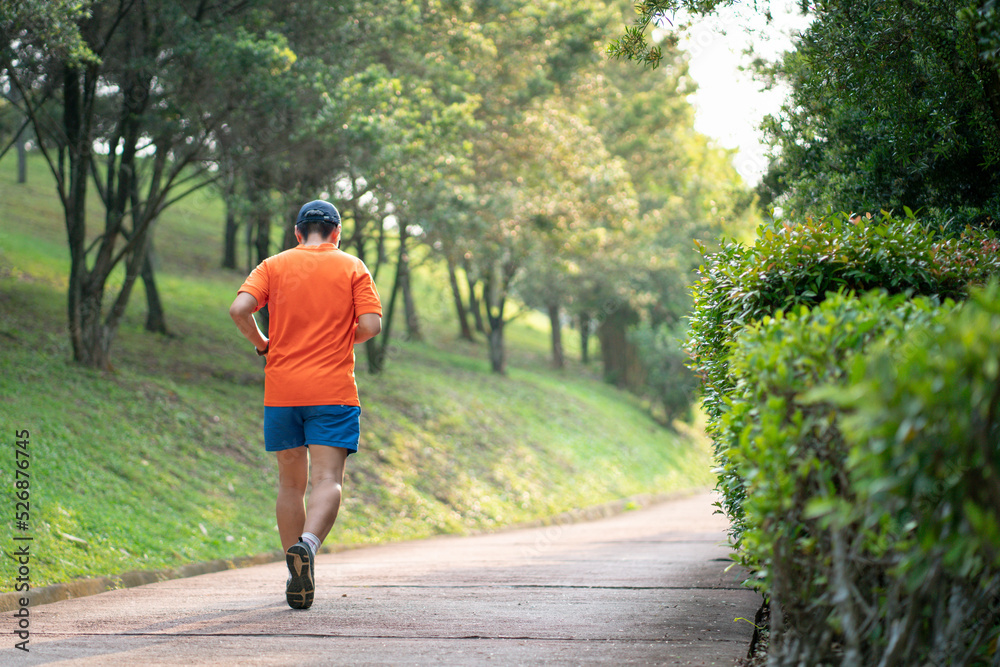 Man runner jogging on an outdoor path during sunset. Healthy lifestyle concept. Man runner jogging on an outdoor path during sunset. Healthy lifestyle concept.