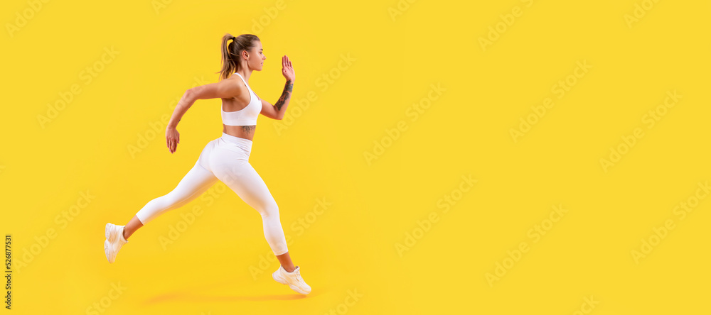 Woman jumping running banner with mock up copyspace. sport girl runner running on yellow background.