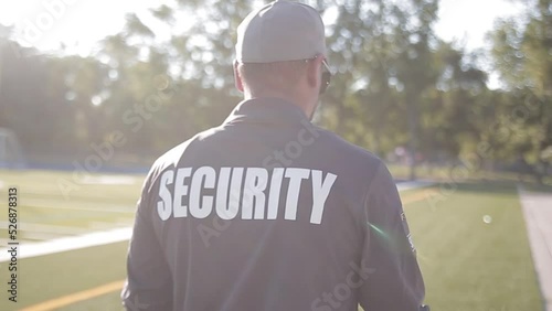 Security guard patrolling soccer stadium