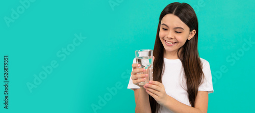 water balance in body. drinking per day. hydration vitality. Banner of child girl with glass of water, studio portrait with copy space.