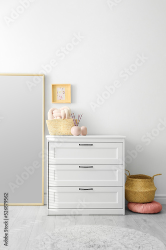 Modern room interior with white chest of drawers © New Africa