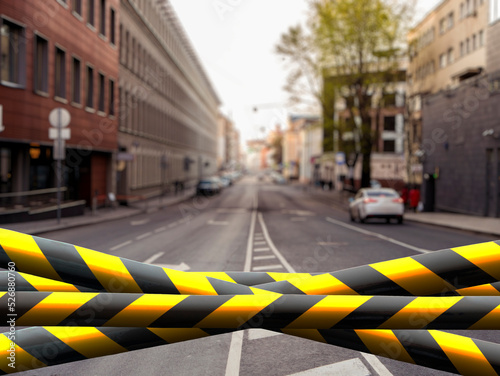 black and yellow safety tape outdoors in the street, restricted area