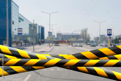 black and yellow safety tape outdoors in the street, restricted area