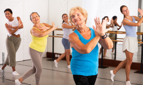 Women of different ages dancing together during their group training.