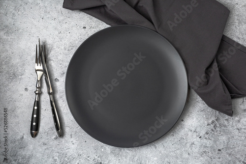 Wallpaper Mural Empty black slate plate on grey stone table and napkin