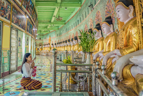 Myanmar woman praying at Umin Thonze Pagoda Sagaing hill Mandalay Myanmar