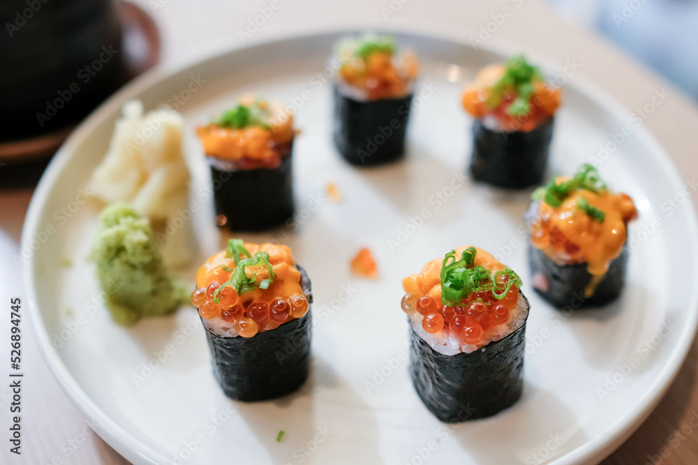 Salmon eggs or Ikura in Japanese style sushi fresh from raw salmond fish in the restaurant. Salmon eggs or Ikura in Japanese style sushi fresh from raw salmond fish in the restaurant.