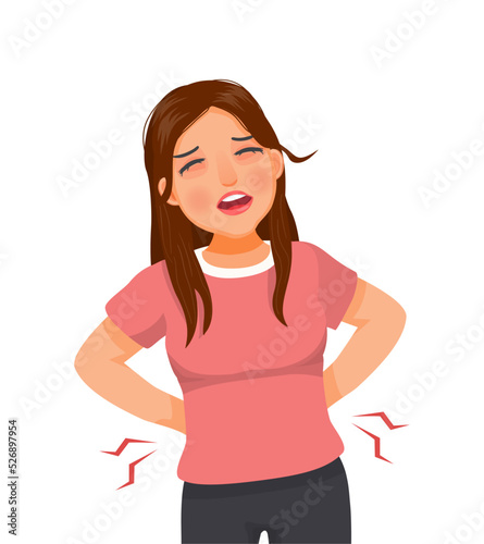 beautiful young woman suffering from lower back pain 