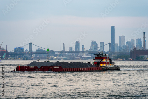 barge in front of Williamsburg Bridge