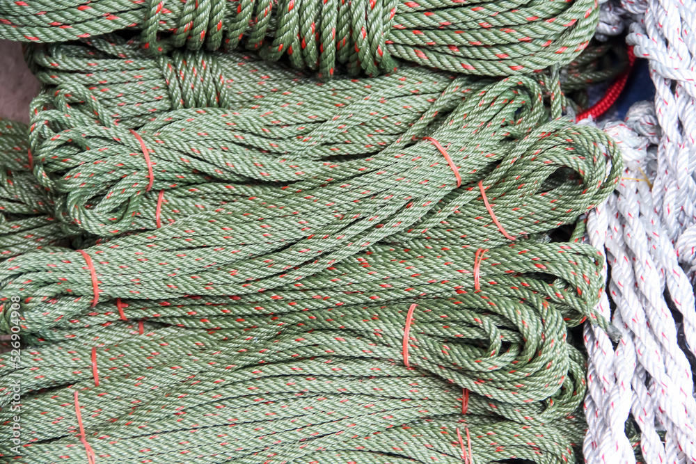 Green rope with red patterns bundles group on background