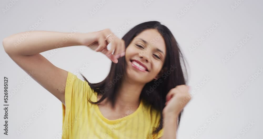 Dance, music and party with a happy, free and moving woman in studio against a gray background. Portrait of a young female dancer dancing and feeling carefree with a smile next to mockup space Dance, music and party with a happy, free and moving woman in studio against a gray background. Portrait of a young female dancer dancing and feeling carefree with a smile next to mockup space