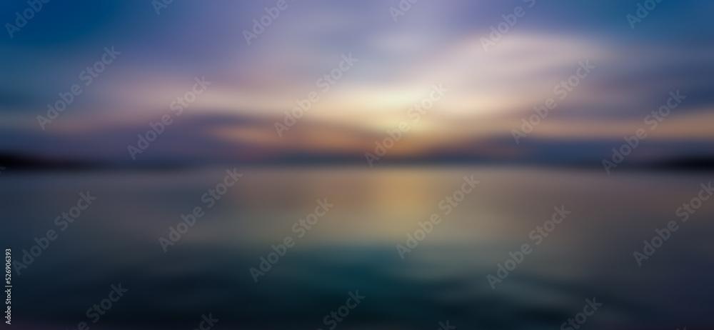 Abstract background of evening sky and sea, blurry pattern. Water pattern at sunset and blur. Lake, clouds, yellow light from the twilight sun.