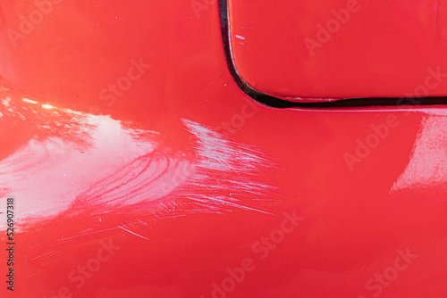 White scratches on the red car.  photo