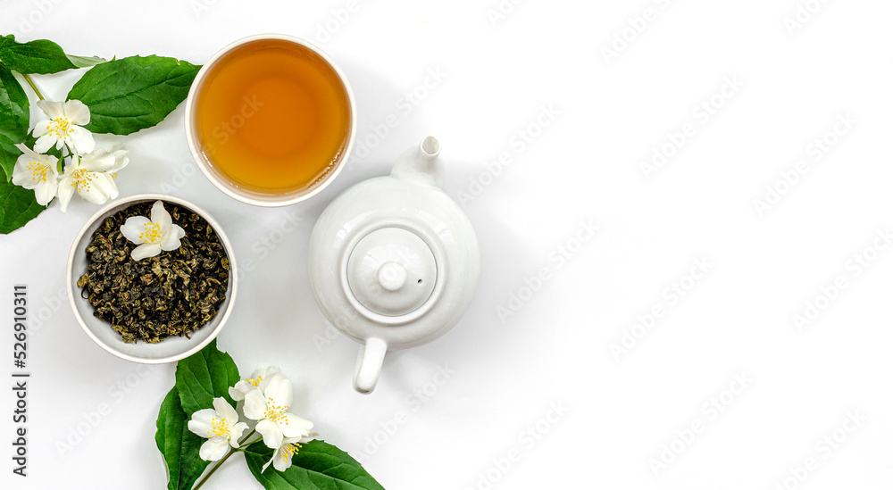 jasmine tea in a cup and kettle for dietary nutrition, jasmine branches