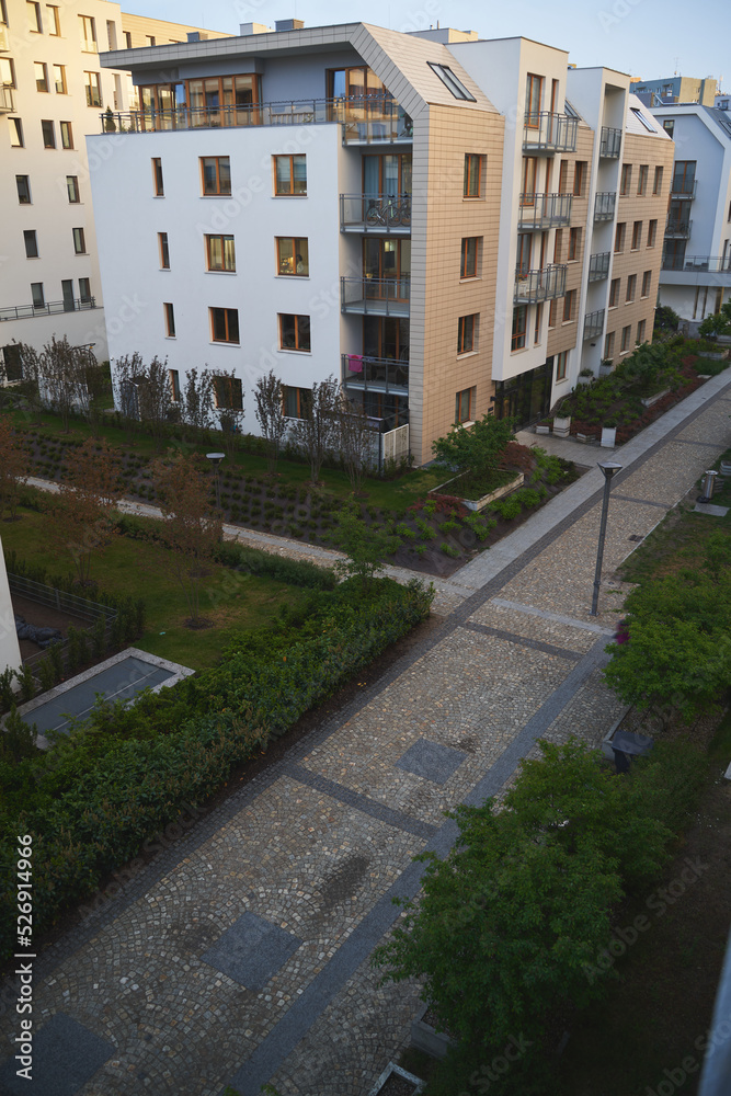 Fototapeta premium Exterior of a modern apartment buildings with balcony and white walls.