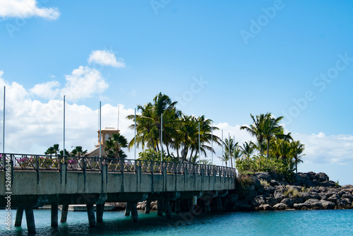 A bridge or pier over the ocean in Barbados on a summer day. 