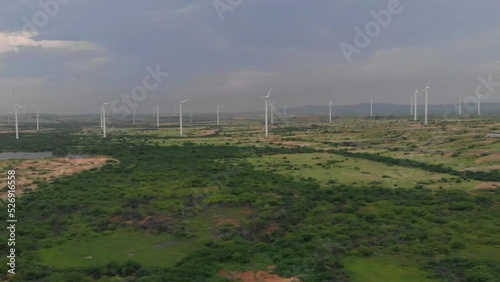 Aerial View Of Jhimpir Wind Power Plant On Overcast Day. Slow Dolly Back photo