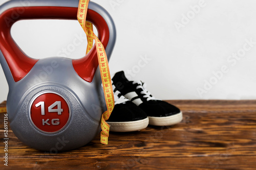 a sports kettlebell on a wooden background. Healthy lifestyle. © mihail39