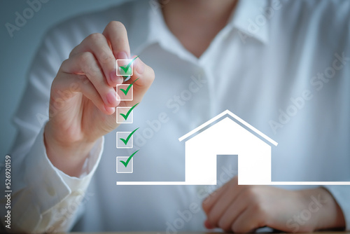Checklist while buying your House. Real estate concept. Check mark completed for home buying checklist. refinance, home loan, tax, mortgage, buy, rent and property investment. photo