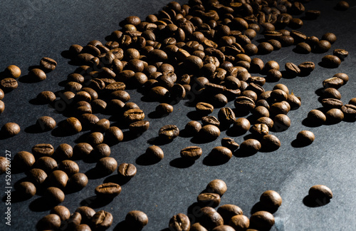 heap of coffee beans on black background