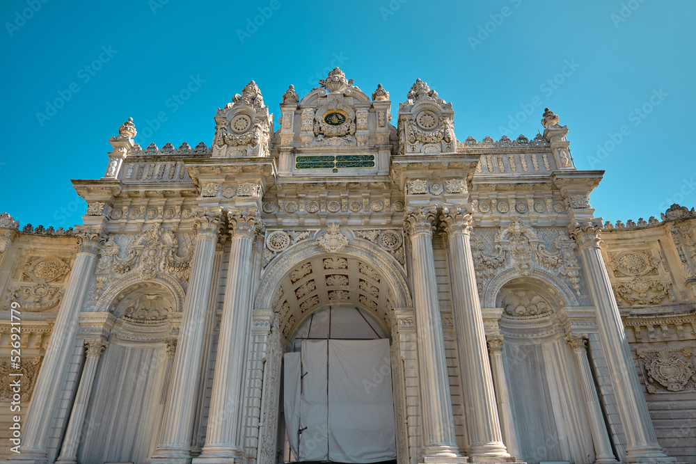 Entrance gate of Dolmabahce palace in Istanbul. Low angle view of iconic baroque style gate. 03.03.2021. istanbul. Turkey.