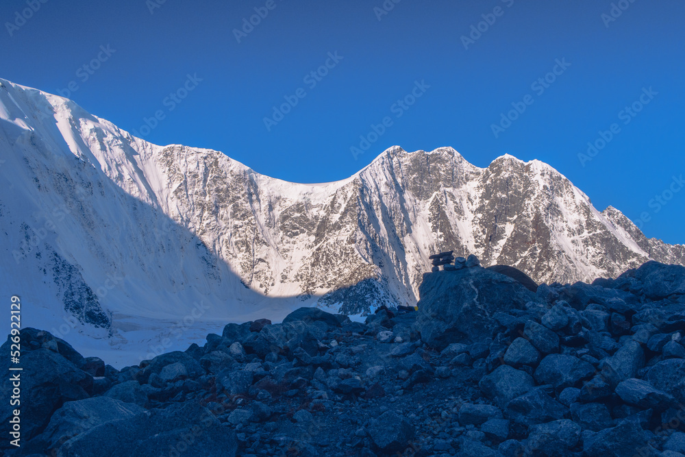 The Crown of Altai mountain peak. Belukha Mountain view. Altai Mountains. Akkem glacier. Beautiful view of the glacier surface with ice and rocks. Glacier ice moraine surface.