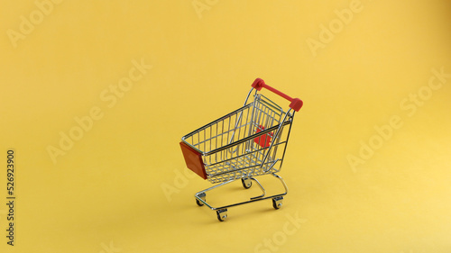 shopping cart yellow background