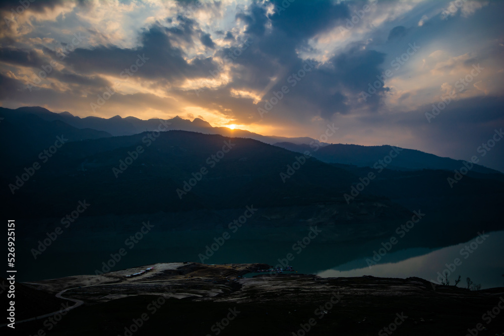 Sunrise view of Tehri mountains. Scenery sunrise over Tehri Lake, Uttarakhand. Tehri Dam, the tallest dam in India and Tehri dam is Asia's largest man-made lake.