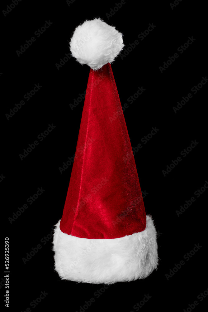 Burgundy New Year's hat of Santa Claus isolated on a black background. Red Christmas cap Burgundy New Year's hat of Santa Claus isolated on a black background. Red Christmas cap