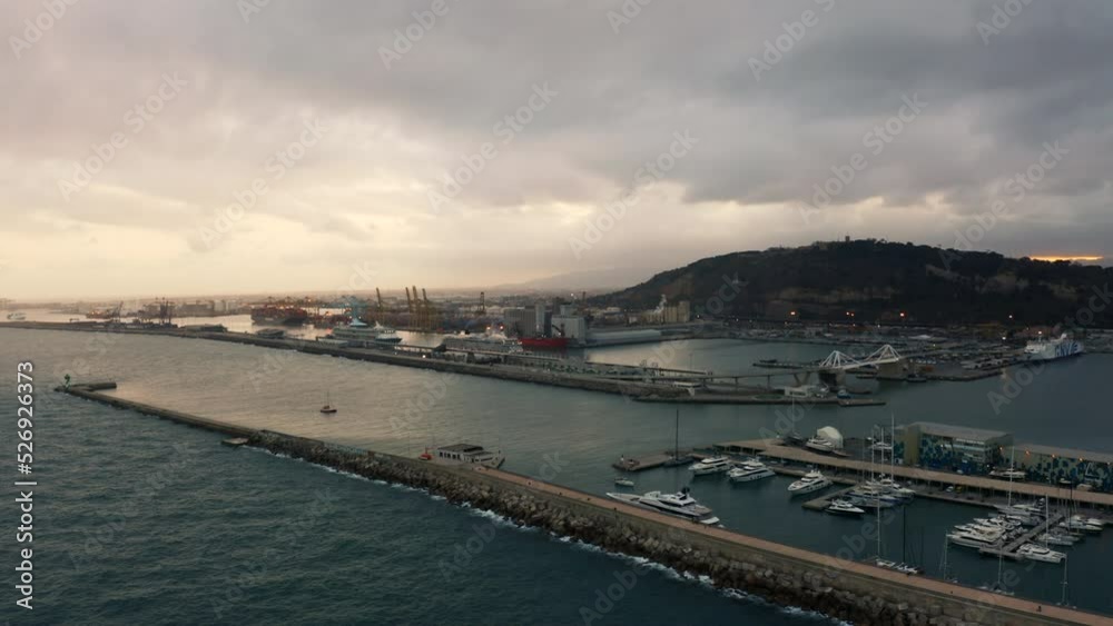 Aerial view around the industrial harbor, cloudy morning in Barcelona, Spain - circling, drone shot Aerial view around the industrial harbor, cloudy morning in Barcelona, Spain - circling, drone shot