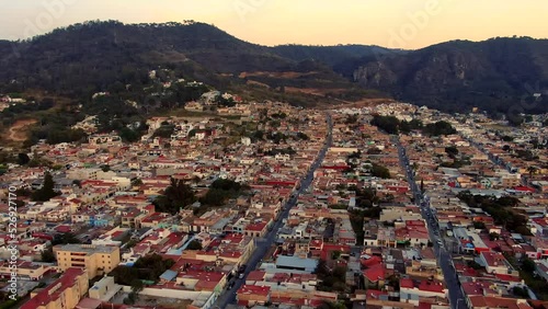 Aerial View Of Ciudad Guzman City With Las Peñas Ecological Park In The Background At Dusk In Jalisco, Mexico. photo